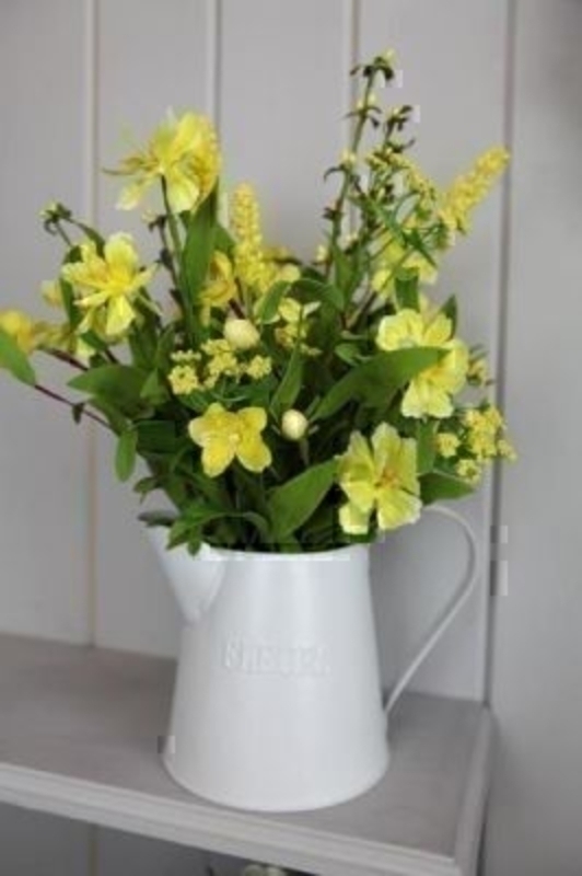 Jug of Yellow Artificial Meadow Flowers by Bloomsbury. Tin Jug with 'Flowers' written on. Can also be called silk flowers the quality of these artificial flowers by Bloomsbury is second to none. For Realistic fake or silk flowers Bloomsbury are the perf